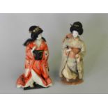 A pair of early 20th century Japanese dolls