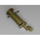 A 19th century brass ship’s gimbal candle holder