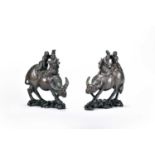 A pair of Chinese inlaid hardwood figure groups of boys on buffalos