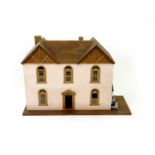 A contemporary, 19th century style dolls house and associated table