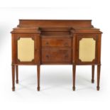 A 20th century inverted breakfront oak sideboard