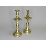 A near pair of 19th/20th century brass candlesticks