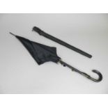 An Edwardian Lautex ladies mourning umbrella