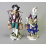A pair of Samson porcelain figures of male and female fruit vendors