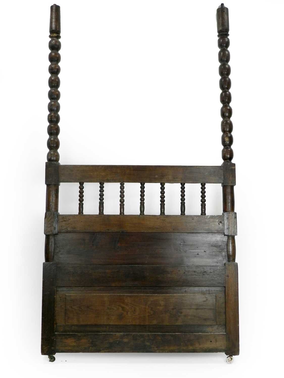 An 18th/19th century oak and pine four-poster bed