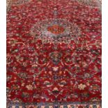 A large Persian Mashad carpet