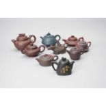 A collection of nine Yixing pottery teapots, 20th century