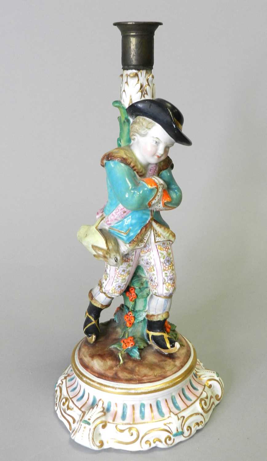 A Fontainebleau (Jacob Petit) porcelain figural candlestick, circa 1862-1874, with a young gallant