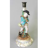A Fontainebleau (Jacob Petit) porcelain figural candlestick, circa 1862-1874, with a young gallant