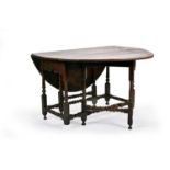 A circa 1700 oval, oak gateleg table