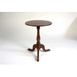 A 19th century oak tripod table