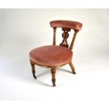 A Victorian carved walnut chair, with a rounded seat covered in rose pink dralon