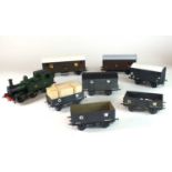 A plastic O-gauge model of a steam locomotive, with 7 goods wagons (8)