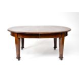 An early 20th century mahogany, extending dining table