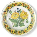 A polychrome Delft dish, 18th centurypainted in yellow, green, orange and blue with two large