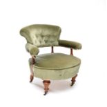 A Victorian armchair with fluted walnut supports and a buttoned back