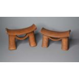 A pair of East African tribal wood headrests
