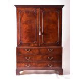 A George III mahogany linen press, converted to a wardrobe