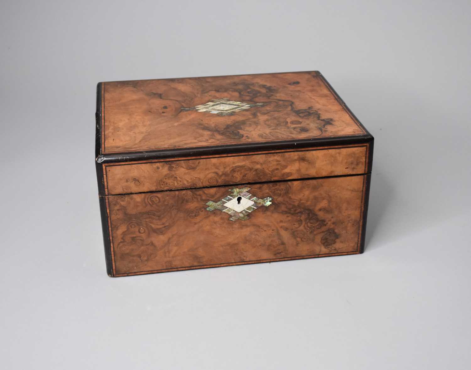 A Victorian figured walnut work box