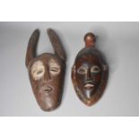 Two African tribal carved wood masks