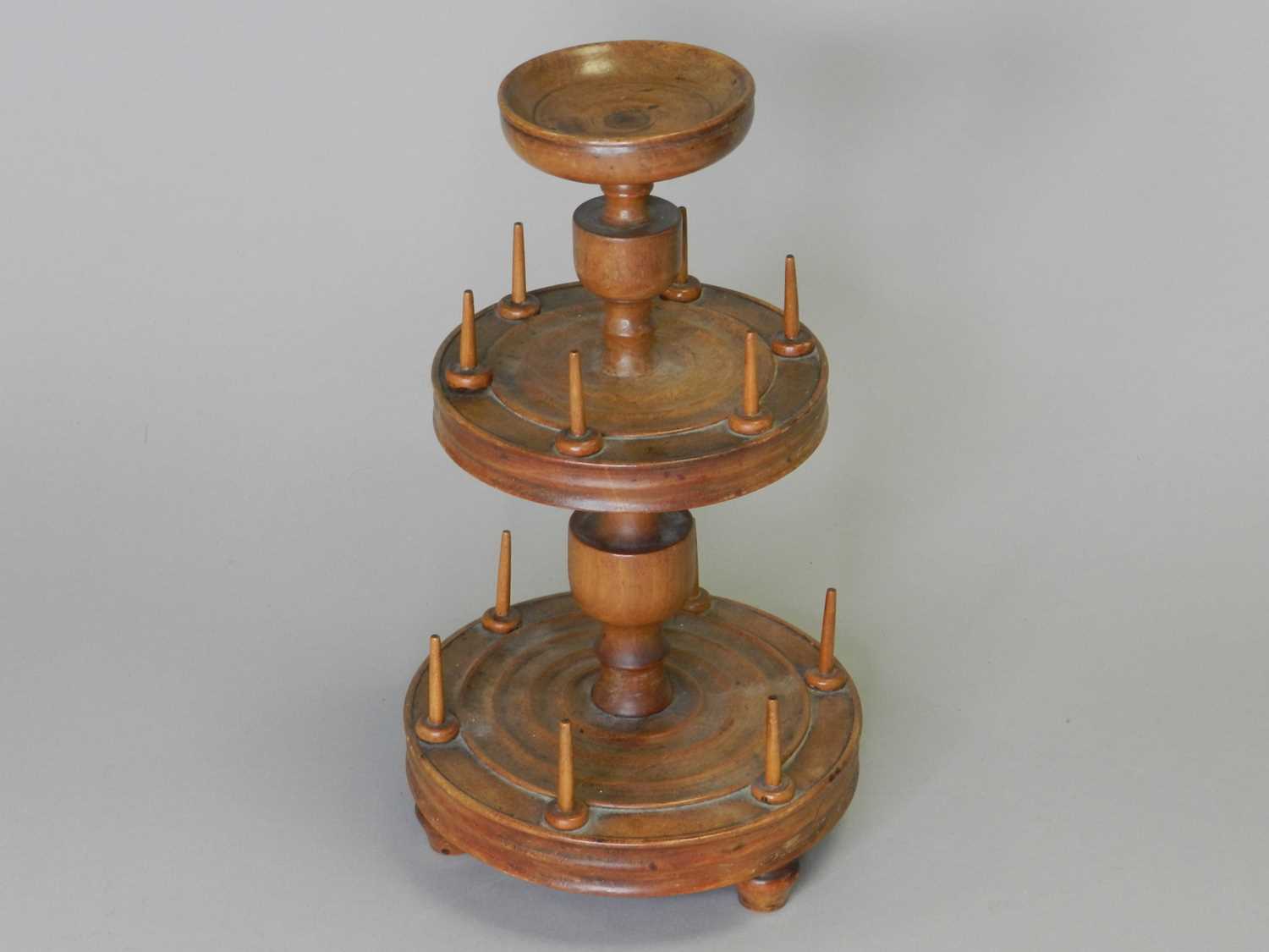 A collection of treen, including a Victorian cotton reel stand and a money box