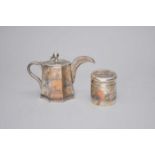 A white metal teapot and tea cannister