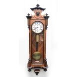 A parcel ebonised rosewood and mahogany single-weight Vienna wall clock