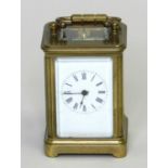 An early 20th century miniature carriage timepiece, obis case and with a 1.75” enamelled dial, an