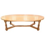 A large light oak oval dining table by Venables Brothers, Cheswardine