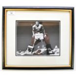 MUHAMMED ALI, Signed photograph. The famous shot of Ali standing over a floored Sonny Liston after