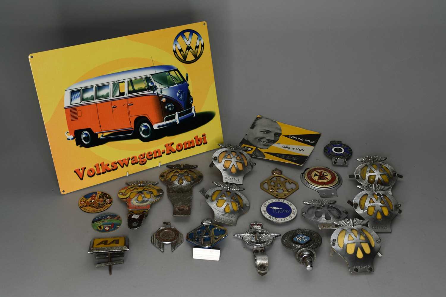 A collection of automobile association and other badges