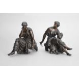 A pair of patinated spelter figures of muses