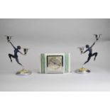An onyx and malachite inlaid Art Deco style mantel timepiece, with a pair of candlesticks (3)