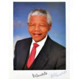 MANDELA, Nelson (1918-2013) African Leader, signed photograph, 210mm x 150mm. With a letter on