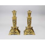 A pair of late 19th century, Louis XIV style, brass candlesticks