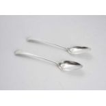 A pair of George III Newcastle silver basting spoons