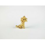 A 9ct gold novelty brooch in the form of a poodle