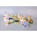 A group of Staffordshire pastille burners, spill vases and models in the form of buildings19th