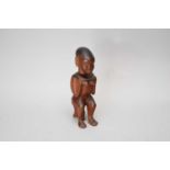 A carved wood Kamba tribal figure, Kenya, East Africa