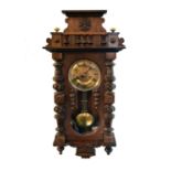 A late 19th century Austrian, walnut wall clock