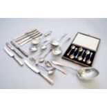 A collection of silver and plated cutlery