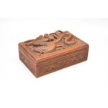 A Chinese carved hardwood cigarette box