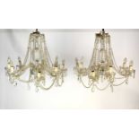 A pair of large cut glass eight-light chandeliers