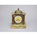 An Edwardian onyx mantel clock