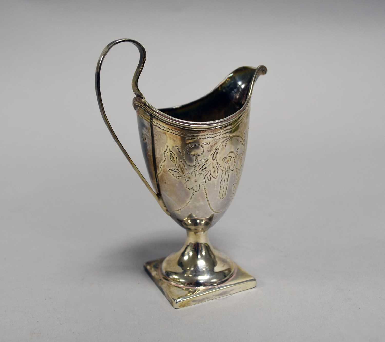 A George III silver helmet cream jug