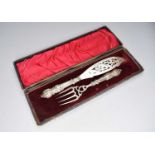 A Victorian cased pair of silver fish servers