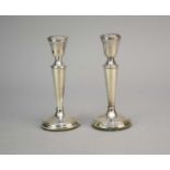 A pair of Dutch silver mounted candlesticks
