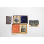 Two Daguerreotypes and two metal mounted leather wallets