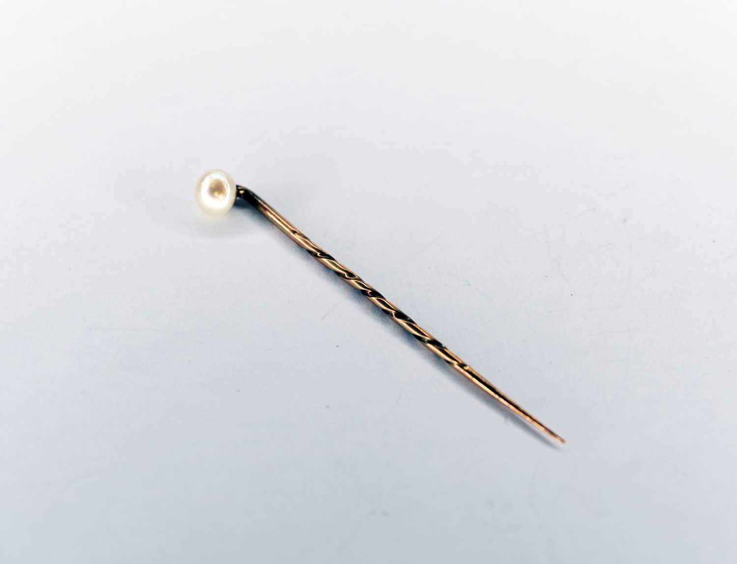 An untested pearl stick pin