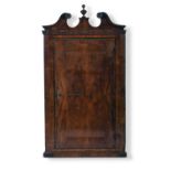 A George II walnut veneered hanging corner cupboard